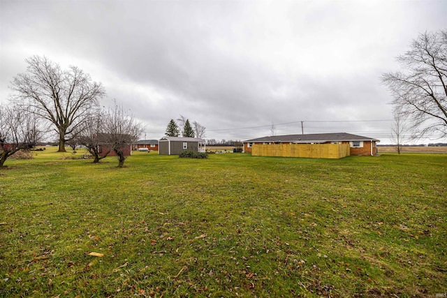 view of yard with a storage unit