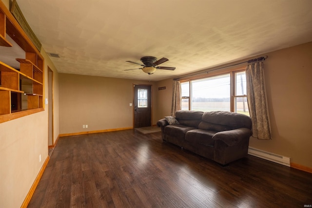 living room with dark hardwood / wood-style flooring, a baseboard radiator, and ceiling fan