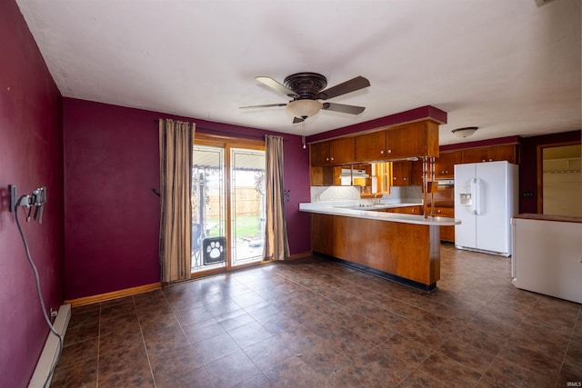 kitchen featuring ventilation hood, ceiling fan, white fridge with ice dispenser, and kitchen peninsula