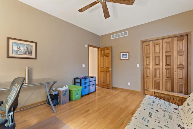 home office with ceiling fan and light hardwood / wood-style floors