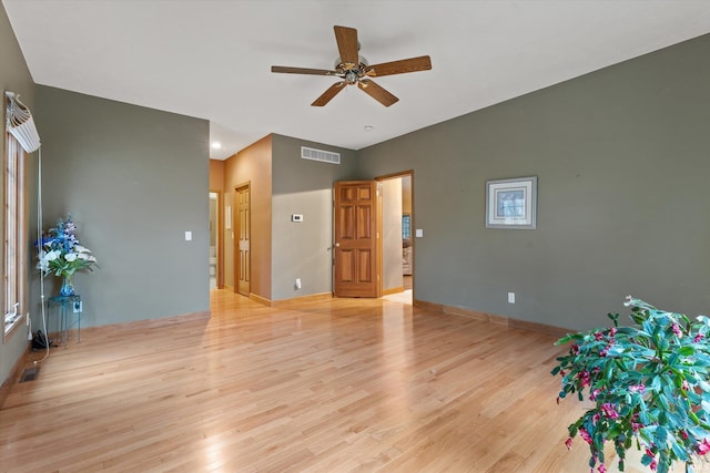 spare room with light hardwood / wood-style floors and ceiling fan