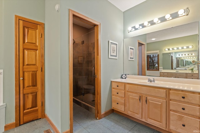 bathroom with tile patterned floors, vanity, and a shower with shower door