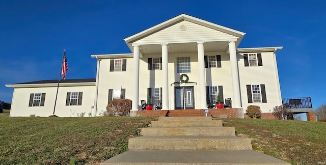 neoclassical / greek revival house with a front yard