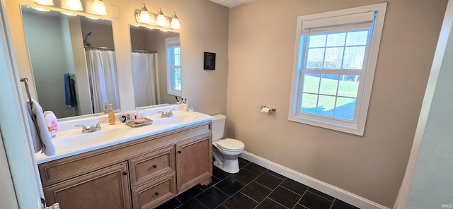 bathroom with vanity, a shower with shower curtain, and toilet