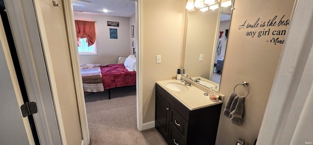 bathroom with vanity and a textured ceiling