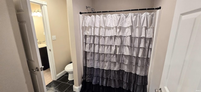 bathroom featuring tile patterned flooring, vanity, toilet, and a shower with shower curtain