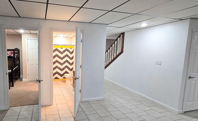 basement featuring a drop ceiling