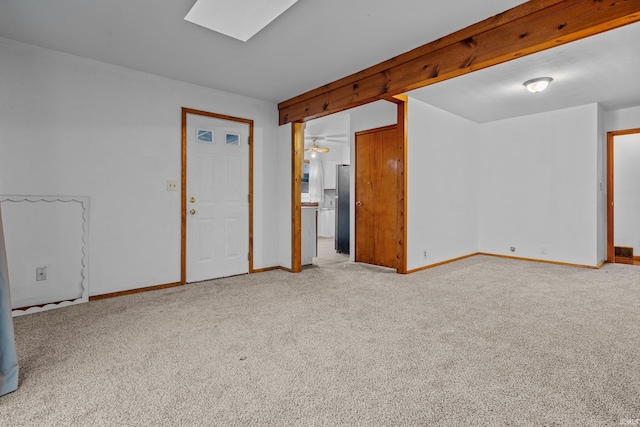 carpeted empty room featuring ceiling fan