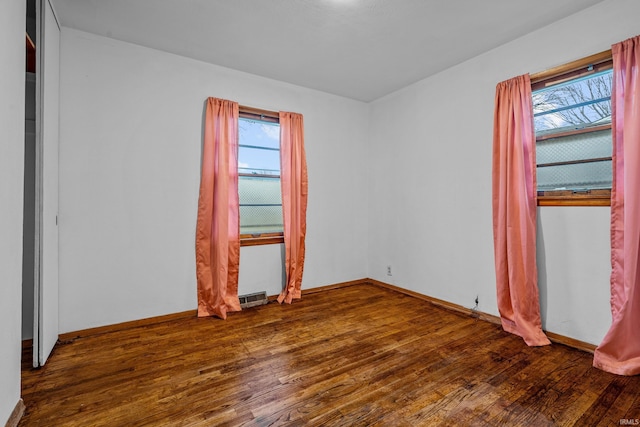 empty room featuring hardwood / wood-style flooring