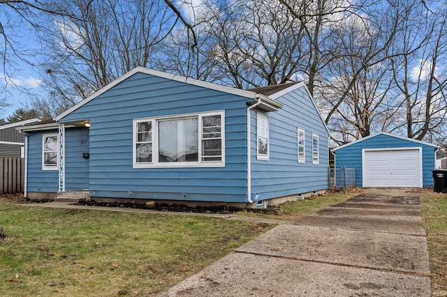 bungalow-style home with a garage, an outbuilding, and a front lawn