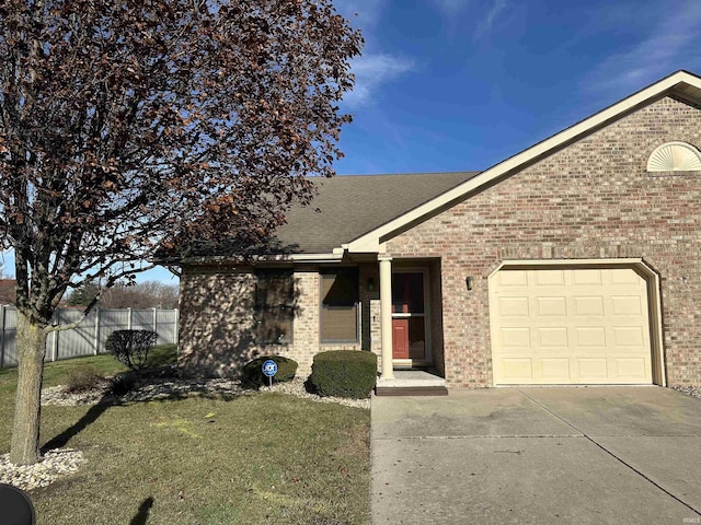 view of front of home with a garage and a front lawn