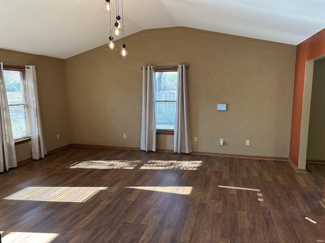 unfurnished room with dark hardwood / wood-style floors, a healthy amount of sunlight, and lofted ceiling