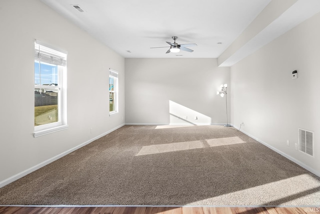 empty room with ceiling fan and hardwood / wood-style flooring