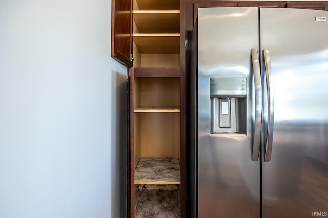 kitchen with stainless steel refrigerator with ice dispenser