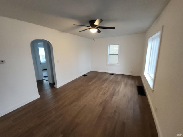 unfurnished room featuring ceiling fan and dark hardwood / wood-style flooring