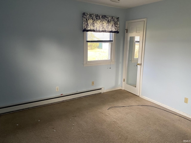 carpeted empty room with a baseboard radiator