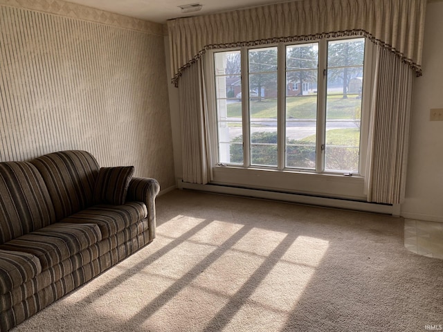 carpeted living room featuring plenty of natural light and a baseboard radiator