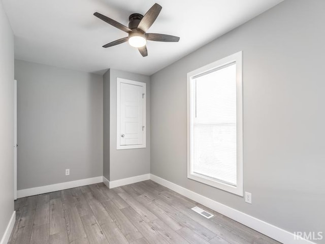 unfurnished room featuring light hardwood / wood-style floors and ceiling fan