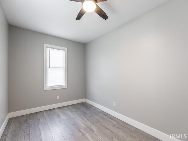 empty room featuring ceiling fan and light wood-type flooring