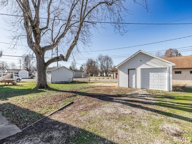 view of yard with an outbuilding and a garage