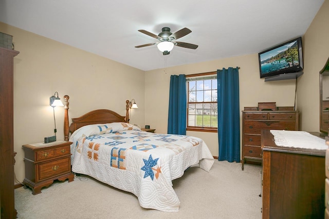 bedroom featuring ceiling fan and light carpet