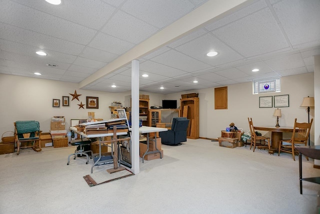 home office with carpet and a drop ceiling