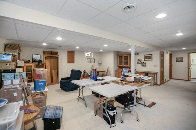 home office featuring light colored carpet and a drop ceiling