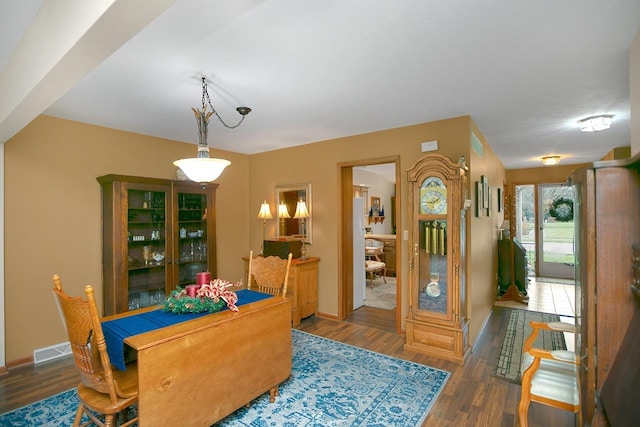 dining room with dark wood-type flooring