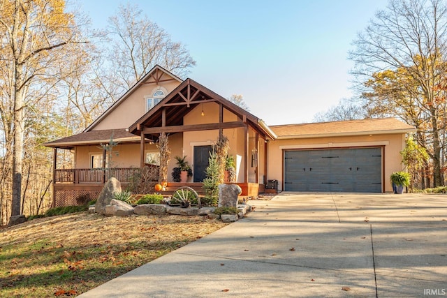 view of front facade featuring covered porch and a garage