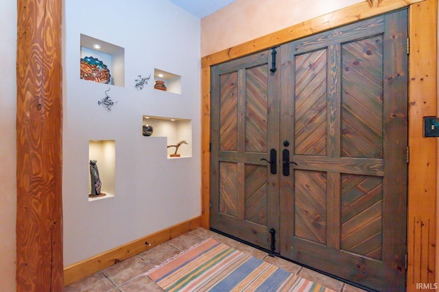 entryway featuring light tile patterned floors