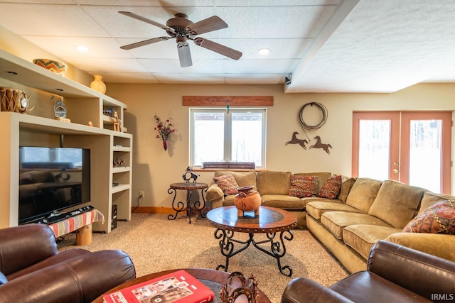 living room with carpet, ceiling fan, and french doors