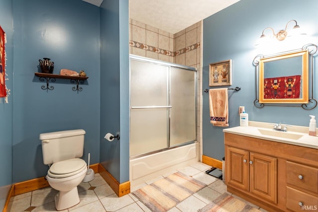 full bathroom featuring toilet, vanity, tile patterned floors, and enclosed tub / shower combo