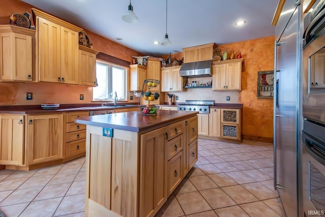 kitchen with light brown cabinetry, light tile patterned flooring, pendant lighting, and range hood