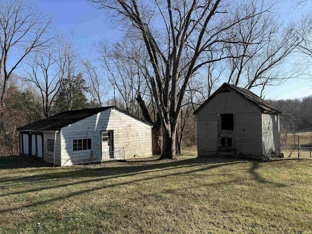 view of outdoor structure featuring a lawn