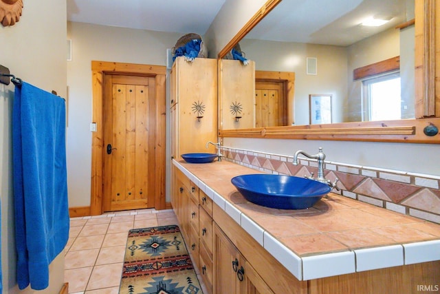 bathroom featuring tile patterned floors and vanity