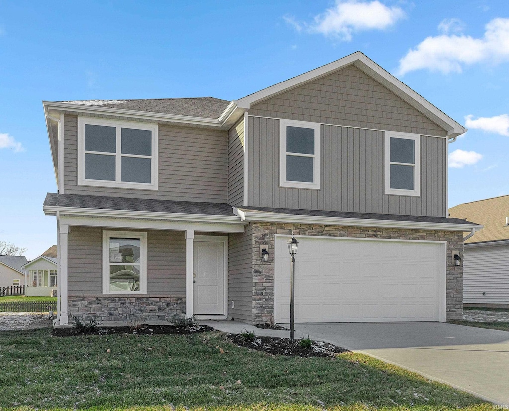 view of front facade with a garage and a front yard