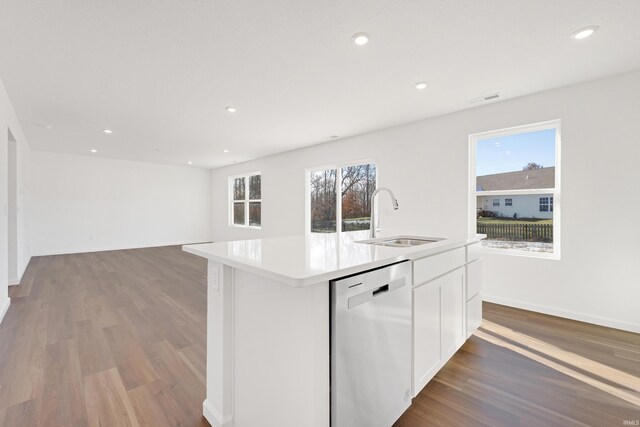 4528 Timber Creek Pkwy, New Haven, IN 46774 - kitchen with white cabinetry, sink, a healthy amount of sunlight, stainless steel dishwasher, and an island with sink