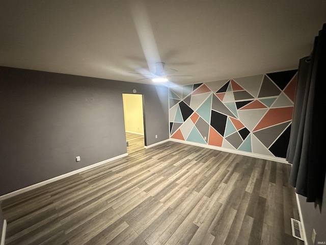 interior space featuring hardwood / wood-style flooring and ceiling fan