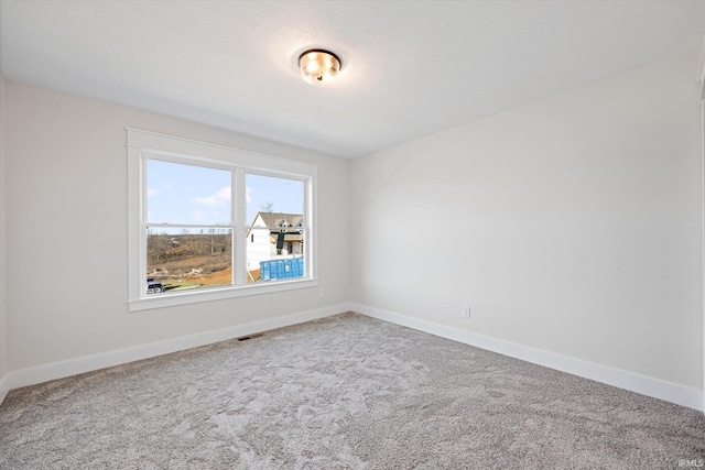 view of carpeted spare room