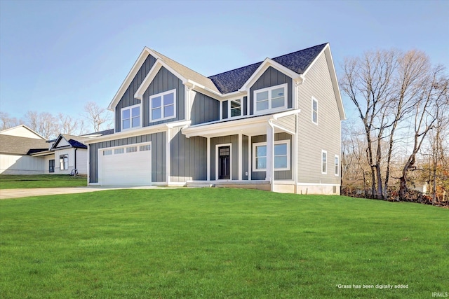 view of front facade with covered porch, a garage, and a front lawn