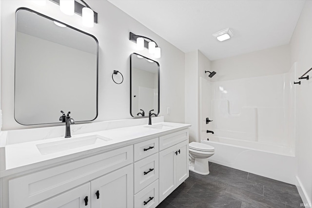 full bathroom featuring vanity, bathtub / shower combination, and toilet