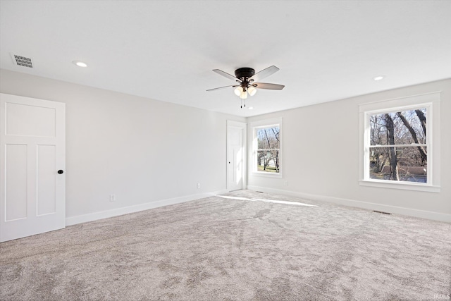 empty room with carpet floors and ceiling fan