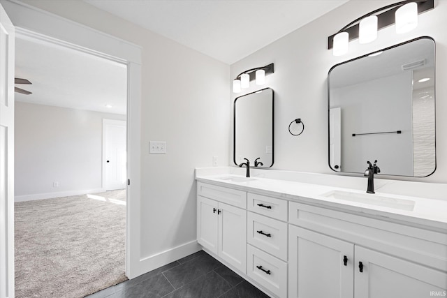 bathroom featuring tile patterned flooring, vanity, and ceiling fan