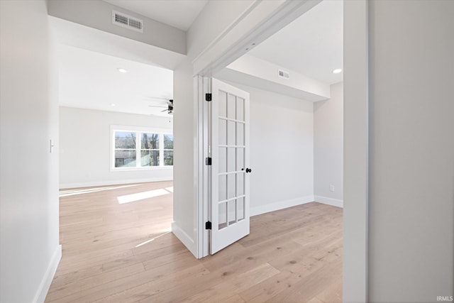 hallway with light wood-type flooring