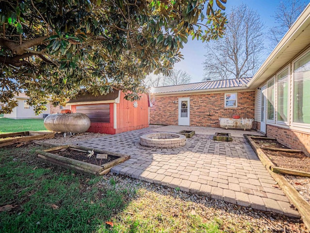 view of patio with a fire pit