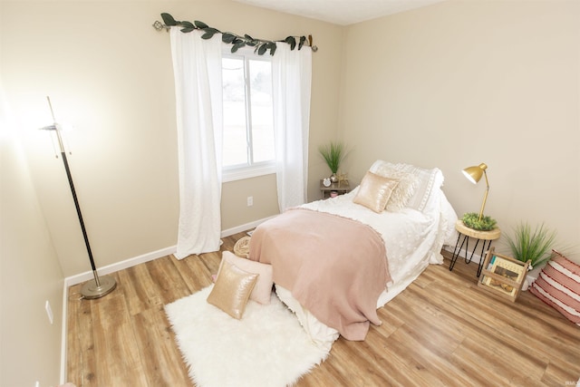 bedroom with light wood-type flooring