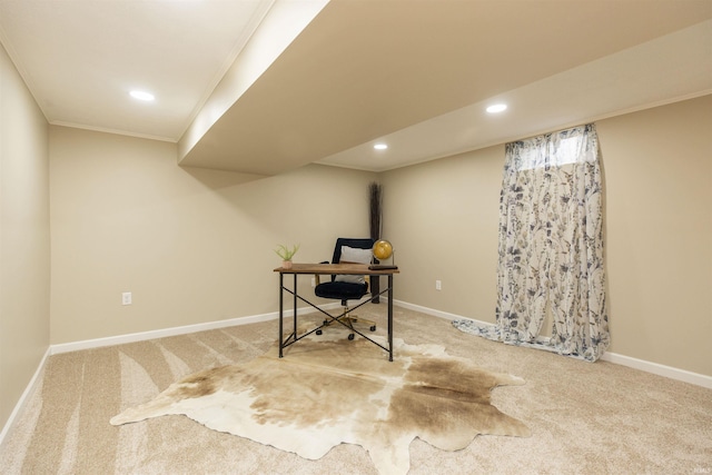 carpeted home office featuring crown molding