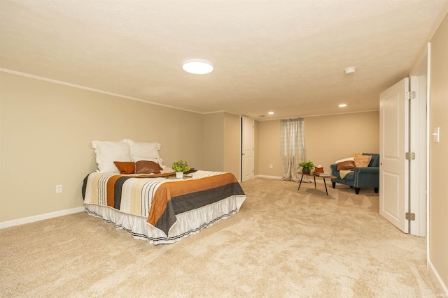 bedroom with crown molding, light colored carpet, and a textured ceiling