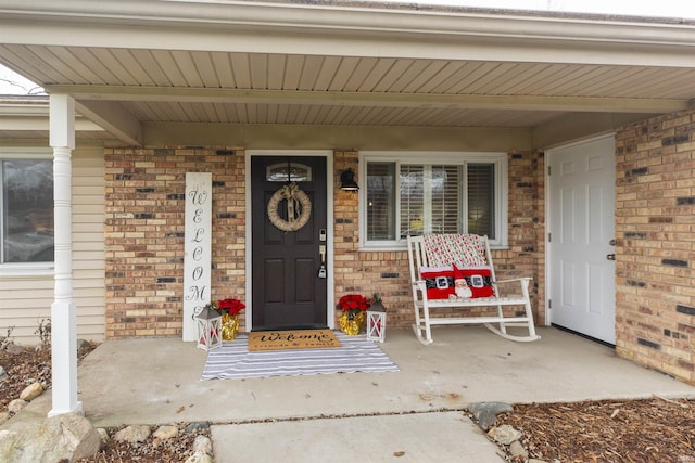 property entrance featuring covered porch