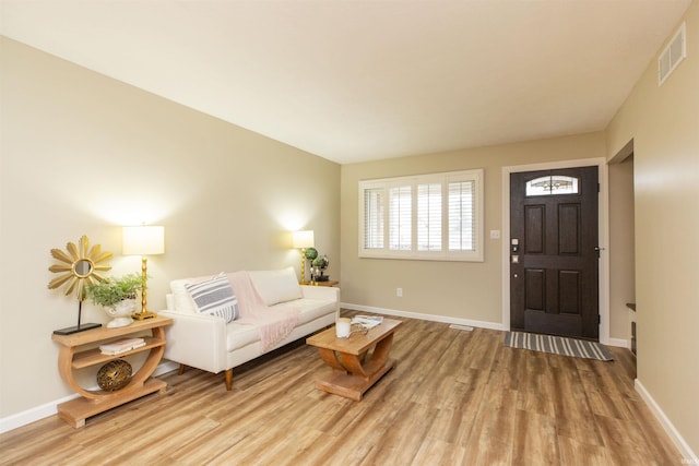 living room with light hardwood / wood-style floors